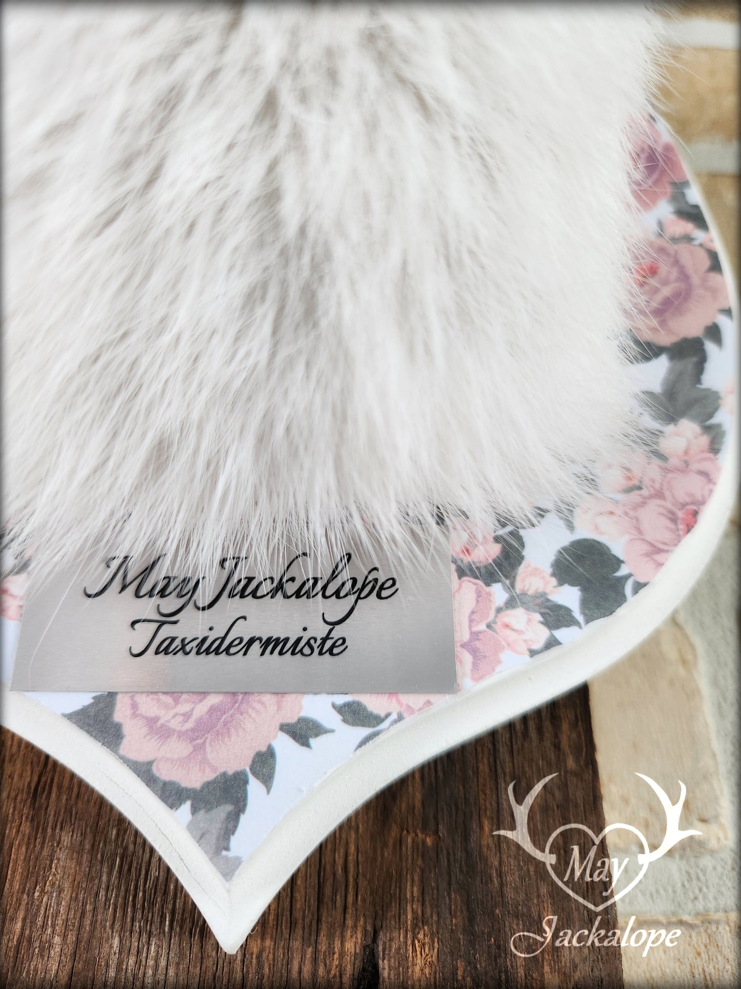 Small jackalope taxidermy, snowshoe hare, white antlers & flower decorated crest plaque