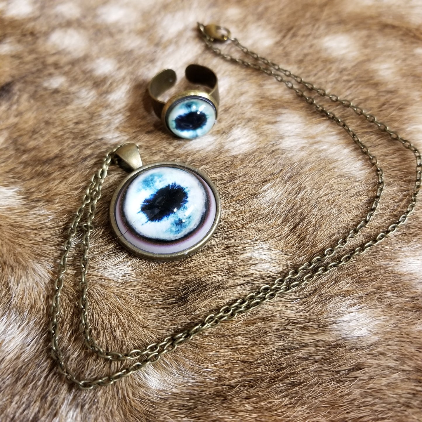 Duo of pendant & adjustable ring with taxidermy eye